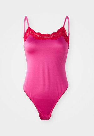 Pink bodysuit with lace trim and adjustable thin straps. Smooth texture, flared bottom, and a fitted silhouette. Accent on neckline.