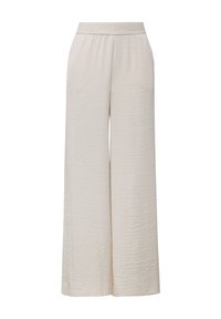 Pantaloni beige a gamba larga, tessuto texturizzato, vita elastica, due tasche laterali e vestibilità ampia, adatti per un abbigliamento casual o rilassato.