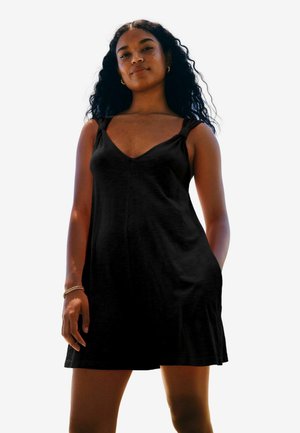 Schwarzes ärmelloses Kleid mit V-Ausschnitt, lockerer Passform und Trägern. Glatte Stofftextur mit A-Linien-Silhouette und seitlichen Taschen.