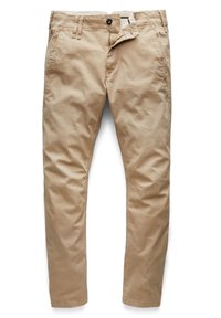 Pantalon décontracté beige avec passants de ceinture, bouton frontal, braguette partiellement ouverte et poches latérales, posé à plat sur fond blanc.
