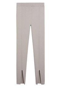 Beige žebrované legíny s přiléhavým siluetou, s bočními rozparky na kotnících. Vyrobené z elastického, texturovaného materiálu.