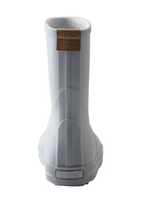 White rubber rain boot with a textured surface and a brown leather tag. Features vertical ridges and a smooth sole for traction.