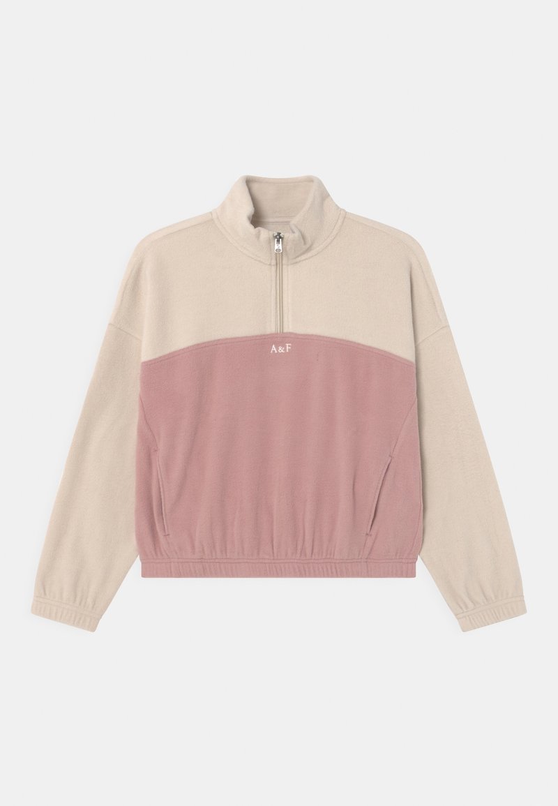 Half-zip pullover in beige en lichtroze fleece. Voorzien van een hoge kraag, elastische tailleband, zijzakken en een geborduurd logo aan de voorkant.