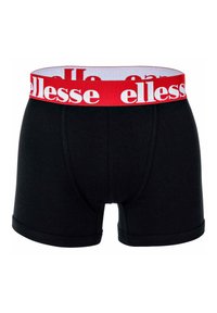 Mustat boxeri-alushousut, jotka on valmistettu pehmeästä kankaasta, jossa on rohkea punainen elastinen vyötärönauha ja valkoinen "ellesse"-brändäys. Sujuva pinta, muotoiltu malli.