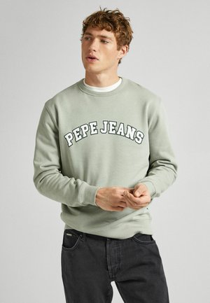 Jasnozielona bluza z kapturem z napisem "PEPE JEANS" w pogrubionym, łukowatym stylu. Projekt zawiera okrągły dekolt oraz ściągacze przy rękawach i u dołu.