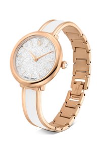 Reloj de acero inoxidable en oro rosa con correa de silicona blanca, con esfera plateada con brillo y manecillas doradas. Fabricado en Suiza.