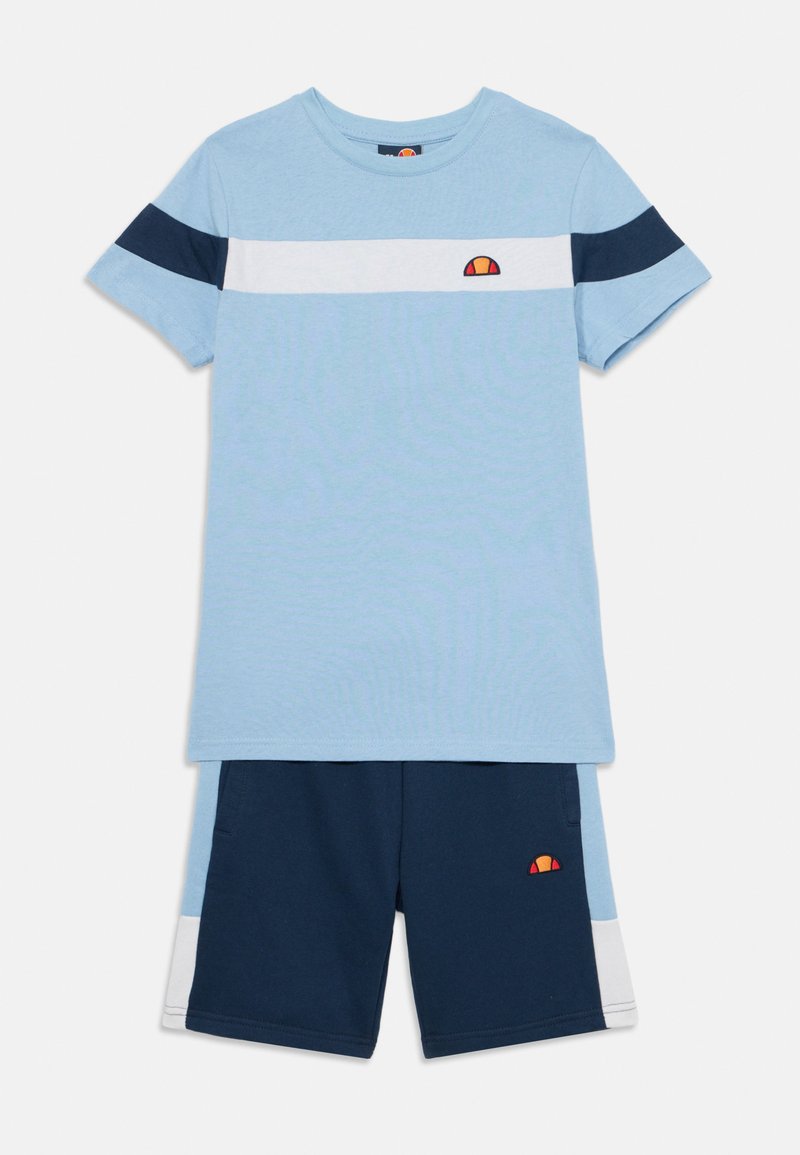 Light blue t-shirt with navy and white stripes, featuring a small logo. Paired with navy shorts, accented with light blue and white detailing.