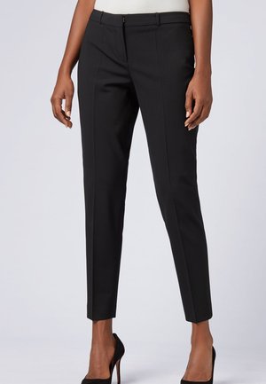 TILUNA - Trousers - black