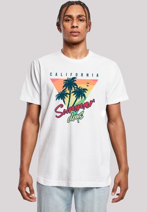 White cotton t-shirt featuring a graphic design with palm trees, a sunset gradient, and the text “California Summer days” in vibrant colors.