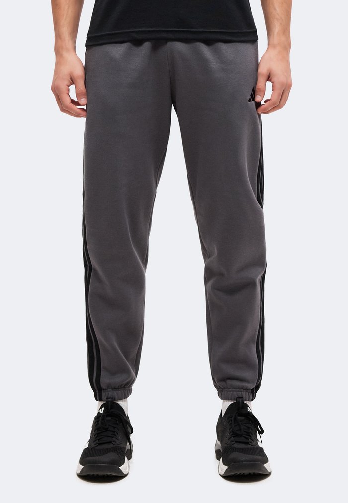 adidas ESSENTIALS 3 STRIPES TAPERED CUFFED PANTS - Tracksuit bottoms - grey five/black