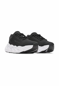 Zwarte sport schoenen met een ademende mesh bovenkant en een dikke witte middenzool met textuuraccenten en een ronde neusontwerp.