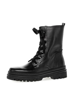 Black leather ankle boot with lace-up front, circular eyelets, and chunky rubber sole. Features a smooth texture and mid-height shaft.