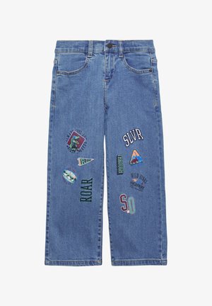 Blue denim jeans with a relaxed fit, featuring embroidered patches in various colors and shapes, including text like "ROAR" and "SLVR."