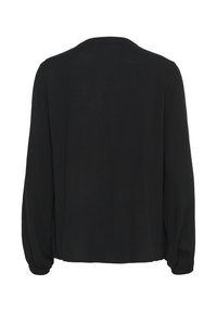 Blouse noire à manches longues en tissu texturé, avec une coupe décontractée, un col rond et des poignets élastiques. Couleur unie sans motifs.