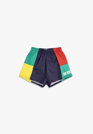 Shorts à blocs de couleurs avec ceinture élastique, présentant des panneaux bleu marine, vert, rouge et jaune, avec le texte blanc "BOBO CHOSES" sur la section verte.