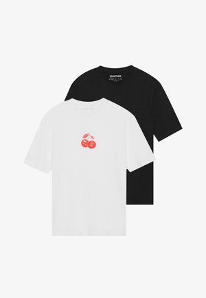 Two short-sleeve t-shirts: one white with a red cherry graphic, the other solid black. Both made of cotton with a crew neck design.