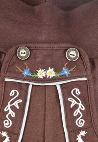 Brown fabric with floral embroidery, featuring blue and white flowers, complemented by cream accents and buttons, and decorative stitching.