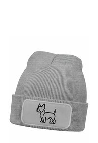 Gray knit beanie with a folded cuff. Features a rectangular patch with a black dog illustration, made of soft, textured fabric.