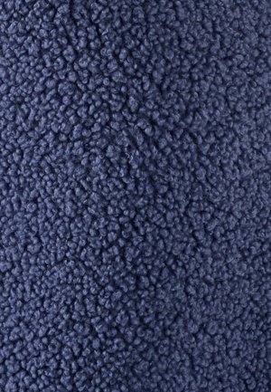 Getextureerde stof in donker marineblauw, met een pluche, donzige oppervlakte en dicht op elkaar gepakte, ronde vezels voor een zachte, tactiele ervaring.