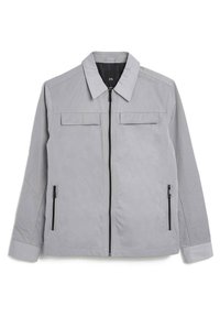 Giacca grigia chiara realizzata in tessuto liscio, con zip frontale, due tasche sul petto e due tasche laterali con zip, maniche lunghe.