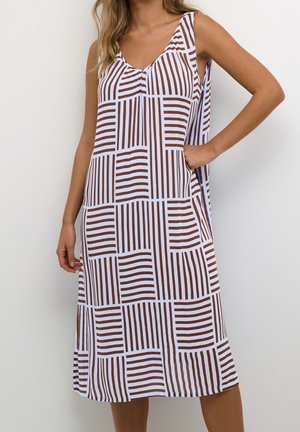 Sleeveless midi dress in white with brown vertical and horizontal stripes, featuring a v-neck and side pockets for a relaxed fit.