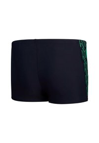 Shorts da bagno da uomo in blu scuro con una texture liscia, caratterizzati da un motivo a zigzag verde neon lungo il lato sinistro. Taglio a metà coscia.