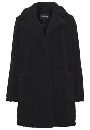 Manteau en polaire noir avec un col, deux poches avant et une coupe décontractée. La texture est douce et duveteuse, offrant une chaleur confortable.