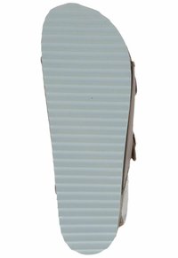 Jasnobrązowe trampki z teksturowaną szarym gumową podeszwą i rowkowanym wzorem dla lepszej przyczepności. Boki wykonane z miękkiego materiału, z rzepem jako zapięcie.