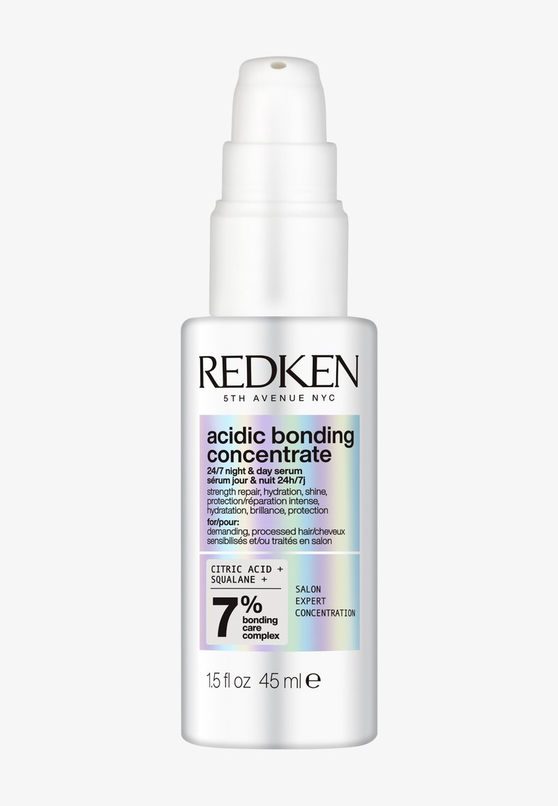 Witte pompflacon met Redken zuurstofactief bonding concentraat serum voor beschadigd haar, 45 ml, met 7% bonding verzorgingscomplex en hydraterende claims.