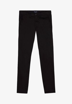 Pantalon en coton noir avec une coupe ajustée, doté de poches avant, d'une fermeture par bouton et d'une texture lisse.