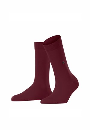 Zwei bordeauxfarbige Socken, die zusammen gezeigt werden, mit einem gerippten Bund und einem kleinen Logo an der Seite, auf einem schlichten weißen Hintergrund.