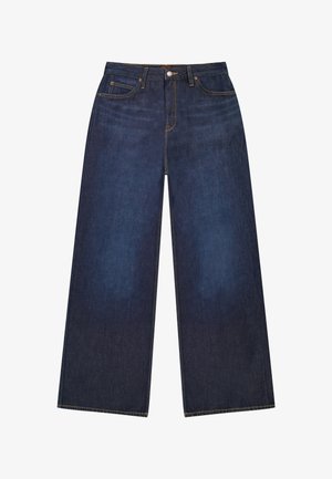 Tmavomodré široké rifle z denimu s piatimi vreckami, zapínaním na gombíky a kontrastným žltým prešívaním.