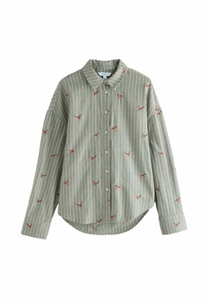Zelena srajca s črtami in gumbi, okrašena z vezenimi živalmi, ima ovratnik, dolge rokave in zaobljen rob. Mehka tkanina.