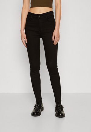 Sorte skinny jeans laget av denim, med et klassisk fem-lomme design, en frontknapp lukking, og en glatt, litt glossy tekstur.