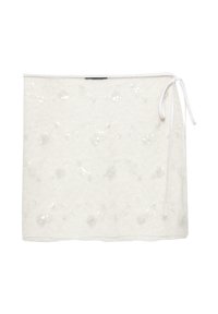 Biała koronkowa spódnica z cekinami, z zapięciem na wiązanie z jednej strony. Lekka, z teksturowaną powierzchnią i elementami kwiatowego wzoru.