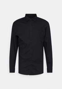 Černá košile s dlouhým rukávem a knoflíkovou légou, klasickým límcem, vyrobená z hladké bavlněné látky. Má celopropínací knoflíky a manžety.