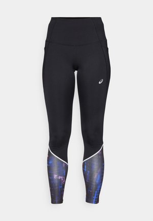 Leggings neri a vita alta con un design aderente, dotati di un elegante motivo colorato nella parte bassa delle gambe e rifiniture bianche lungo le cuciture.