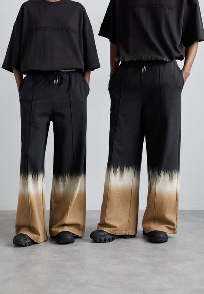Feng Chen Wang UNISEX - Долнище на анцуг - black