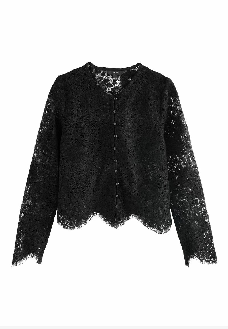 Sort spids cardigan med lange ærmer, en bølget kant og en række sorte knapper på fronten. Indviklet spidstekstur over hele. 