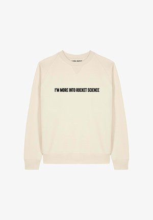 Cremfarbener Pullover mit V-Ausschnitt, ausgestattet mit fettem schwarzem Text, der "Ich interessiere mich mehr für Raketenwissenschaft." liest. Weiches Material und lässige Passform.