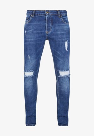 Slim fit jeans i mørkeblå denim, med slitte detaljer og hull på knærne. Klassisk femlommersdesign med glidelås og beltehemper.