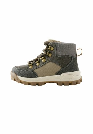 Gray and beige hiking boot with padded ankle, metal eyelets, thick tread sole, and pull tab at heel.