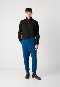 BOSS HADIKO - Spodnji deli trenirk - open blue