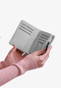 Light grey leather wallet with multiple card slots, a clear ID pocket, and a zippered compartment. Text embossed inside.