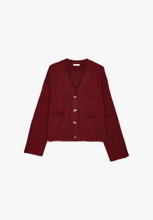 Red knit cardigan with a v-neck, long sleeves, and two front pockets. Features five bronze buttons along the front. Textured fabric.