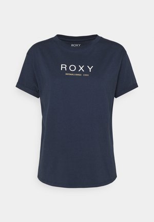 T-shirt à manches courtes bleu marine avec "ROXY" et "ESTABLISHED 1990" imprimés en blanc et jaune sur la poitrine.