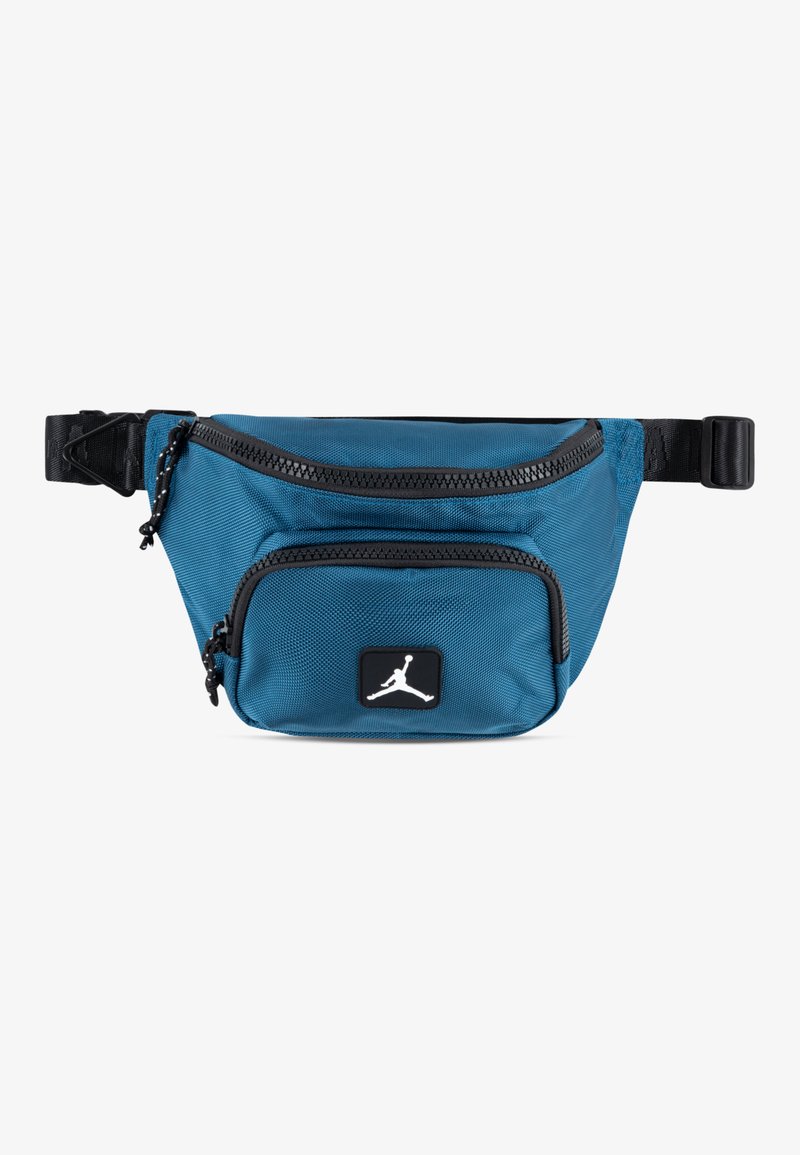 Small blue nylon crossbody bag with black zippers, a front pocket, and a black logo patch featuring a white silhouette. Adjustable strap included.