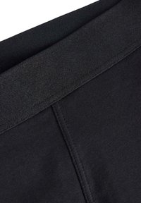Schwarze Yogahosen mit einem glatten Bund, aus einem weichen, dehnbaren Stoff und verstärkten Nähten für Langlebigkeit.