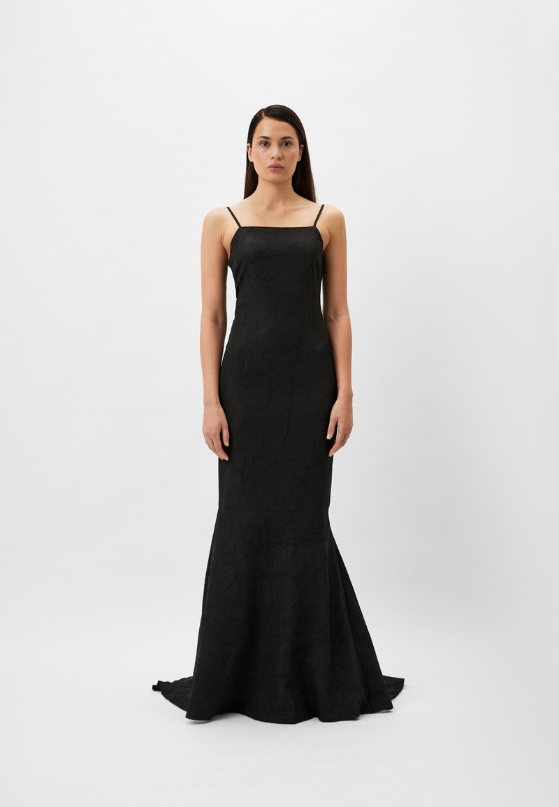 Black evening dress with a fitted bodice, thin adjustable straps, and a flared skirt. The fabric features a textured pattern.