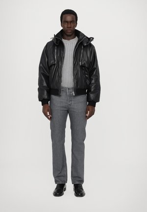 DETACHABLE SLEEVE PADDED JACKET UNISEX  - Faux leather jacket - black